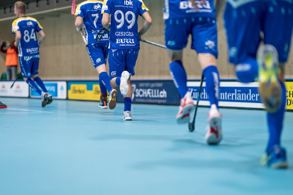 a group of men playing a game of soccer