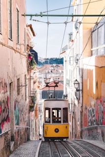 white and yellow tram train