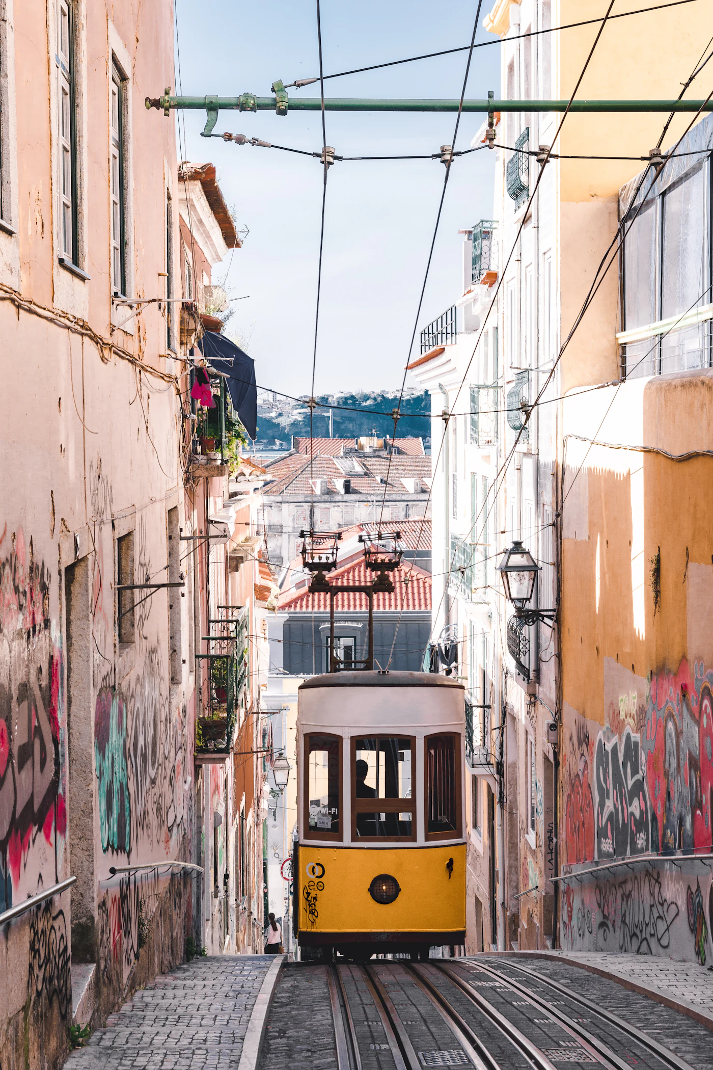 Tram on a narrow street in Lisbon
