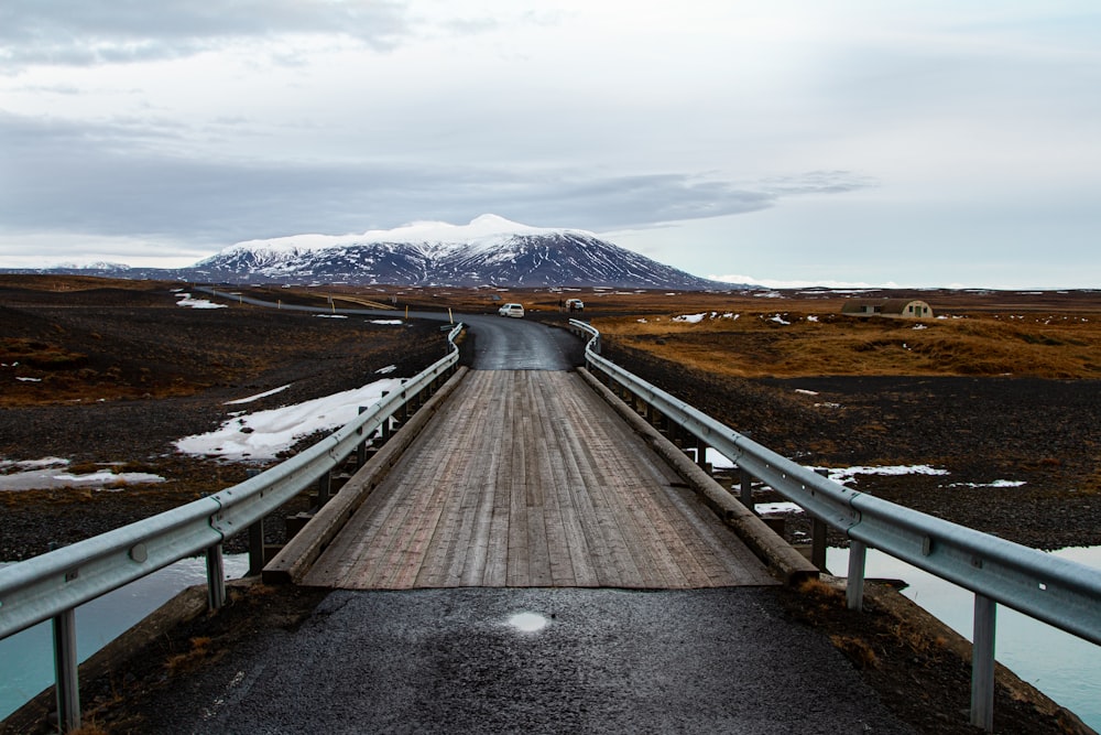 landscape photography of a winding road leading to a mountain