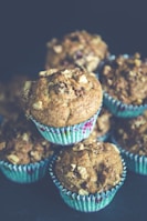 selective focus photo of pile of muffins