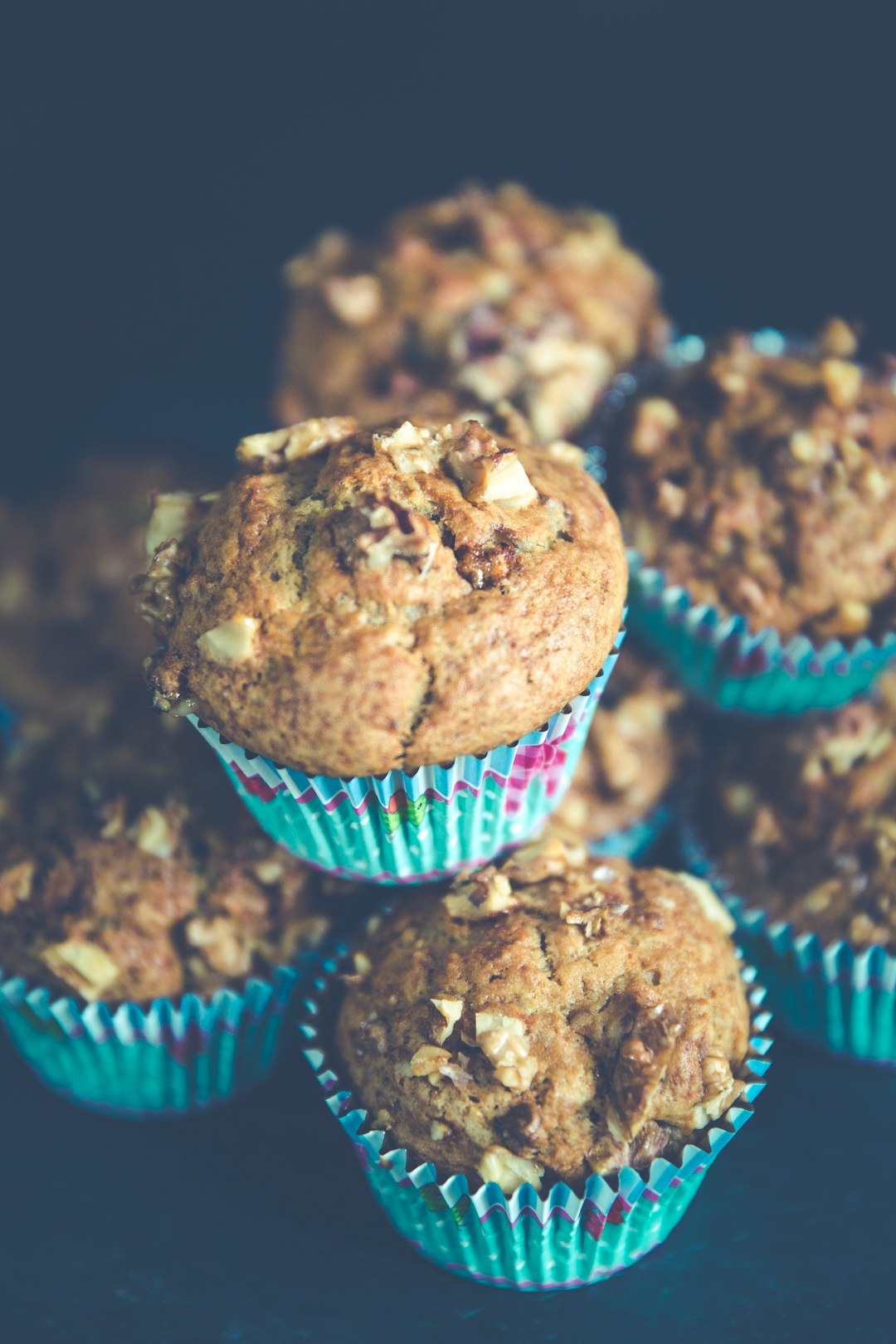 selective focus photo of pile of muffins