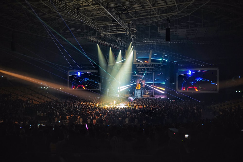 crowd standing inside stadium