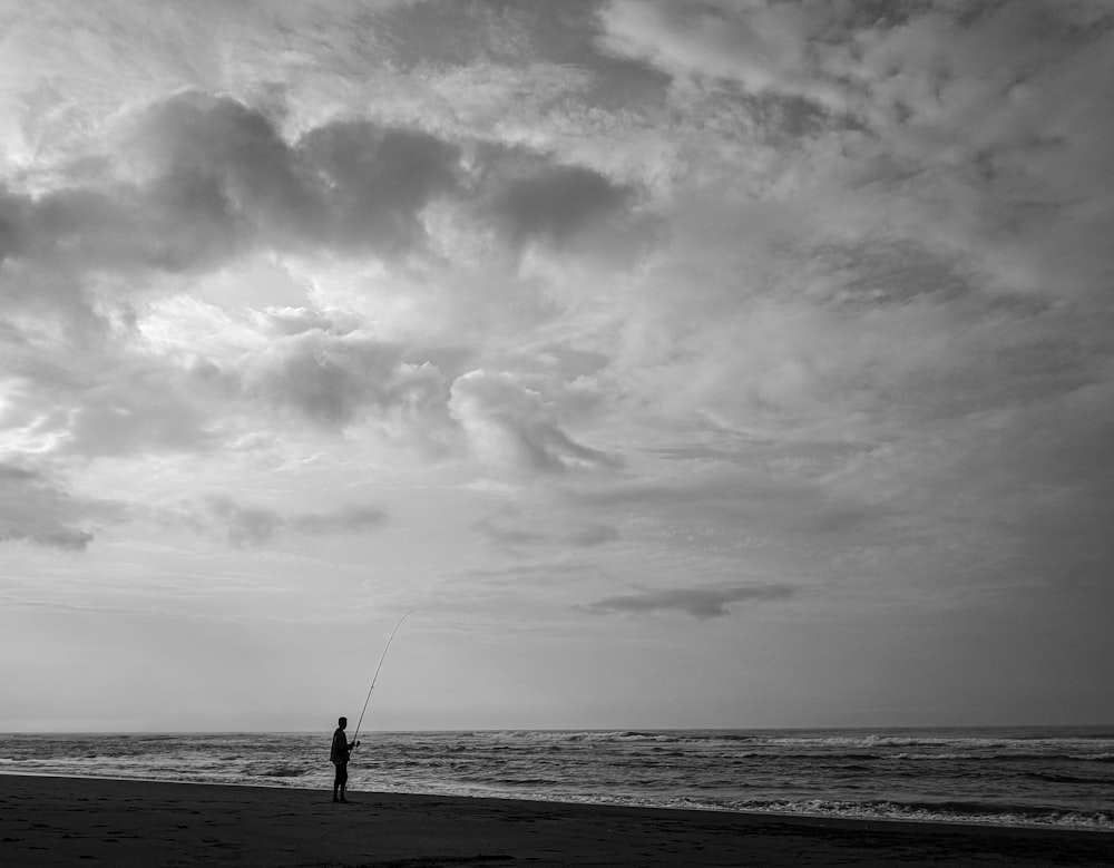 person fishing on body of water