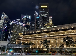 beige high-rise building during night time