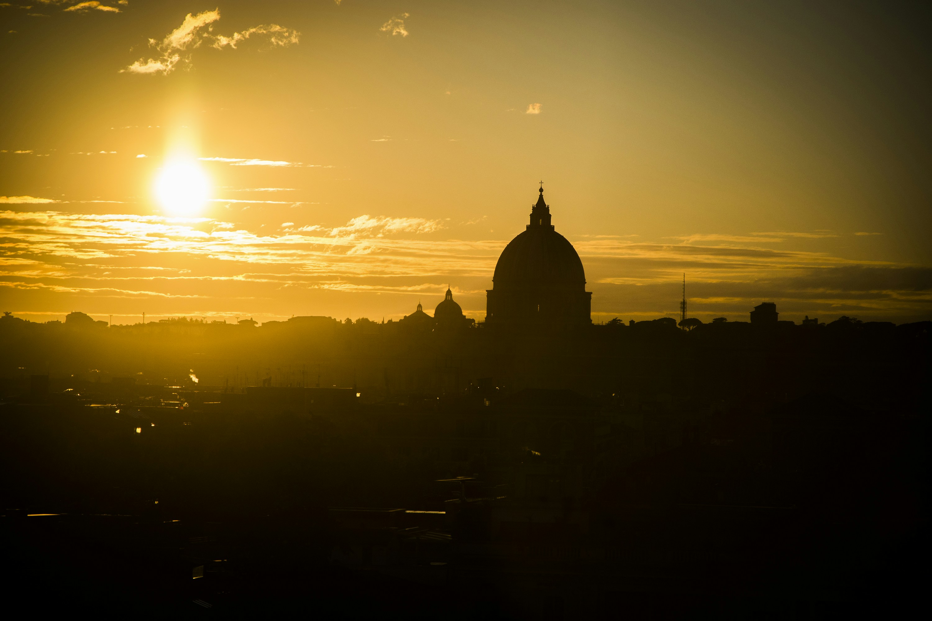 silhouette of dome building during sunrise, A view of Vatican City in the late afternoon