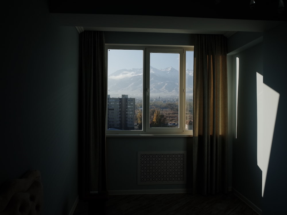 white wooden glass window with brown curtain