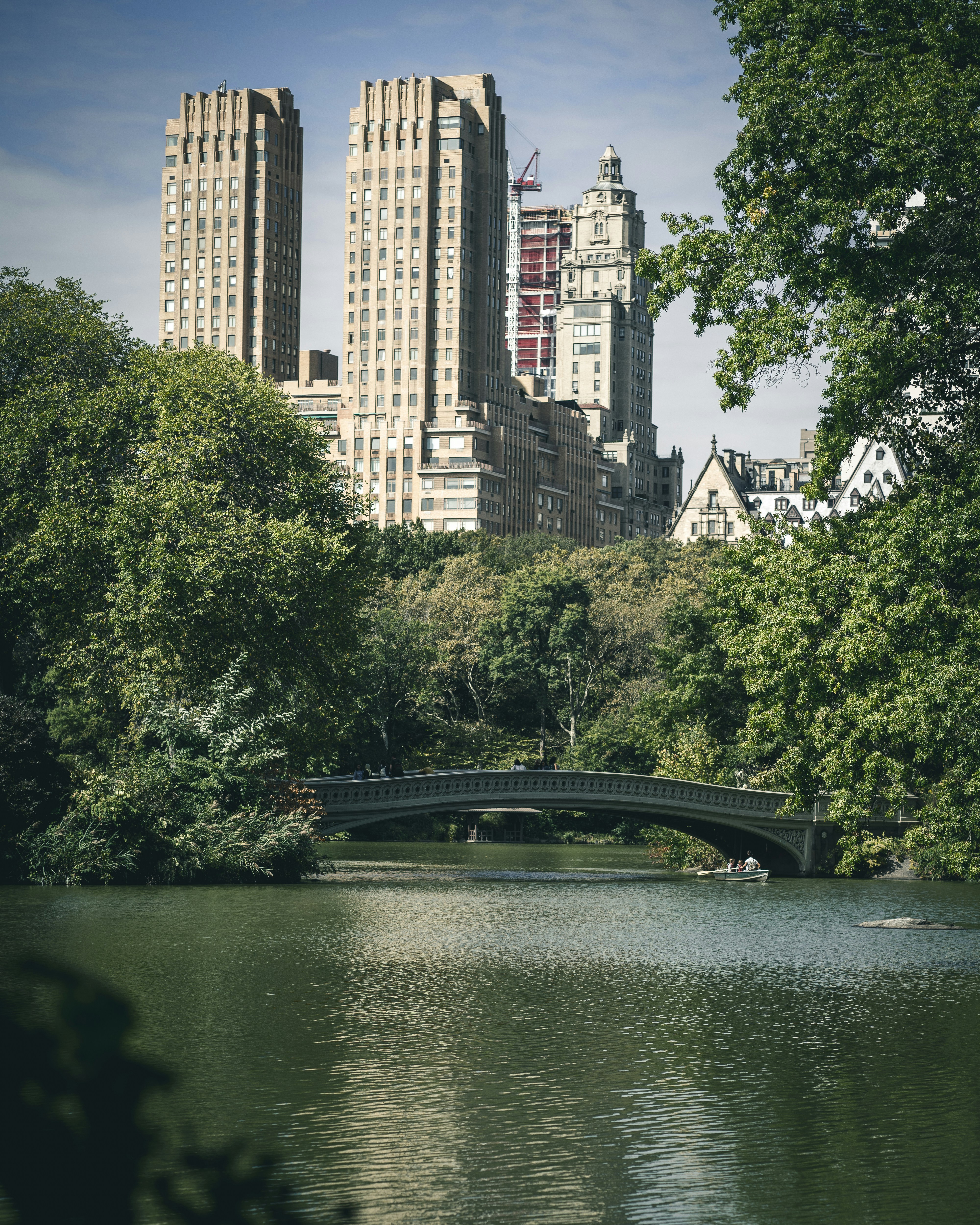 calm body of water overlooking high-rise building