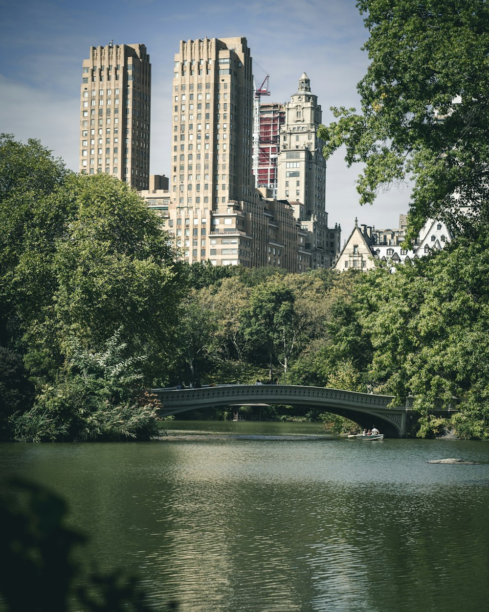 calm body of water overlooking high-rise building