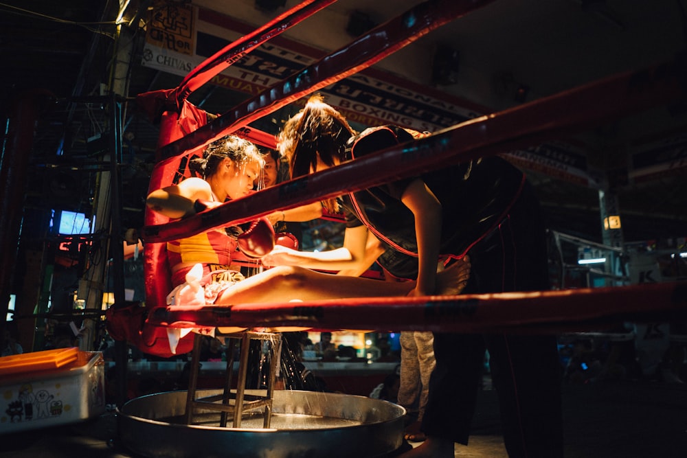 girl sitting on chair inside boxing ring