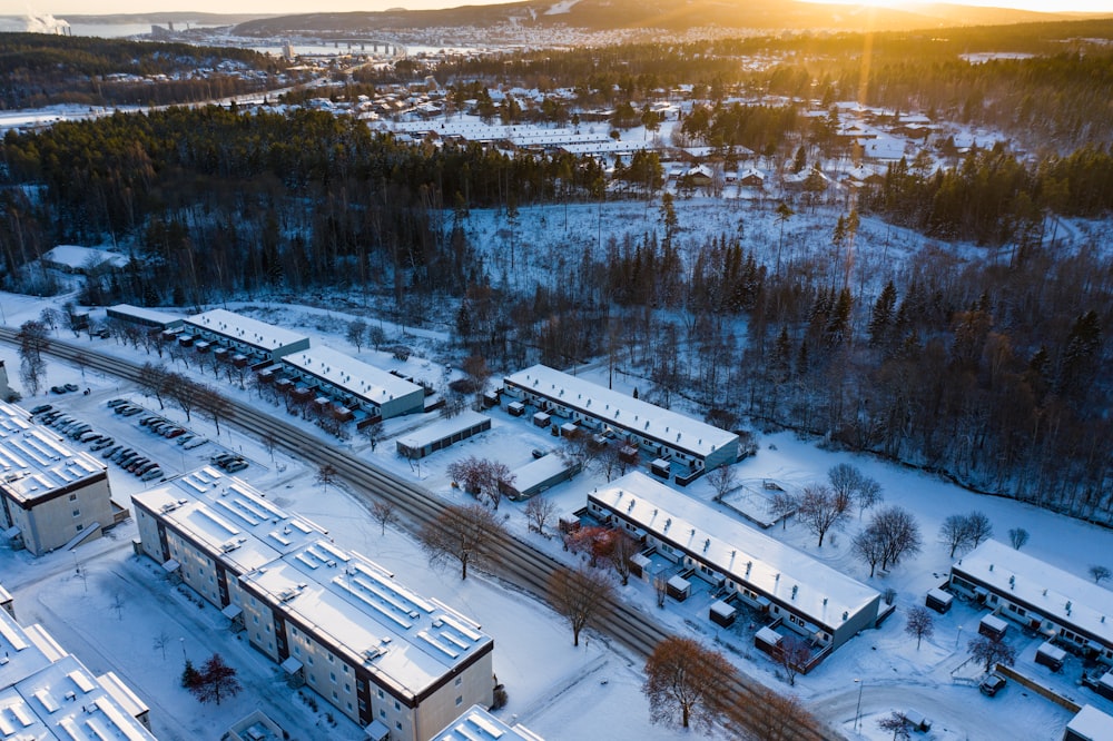 bird's-eye view photo of buildings cape by snow