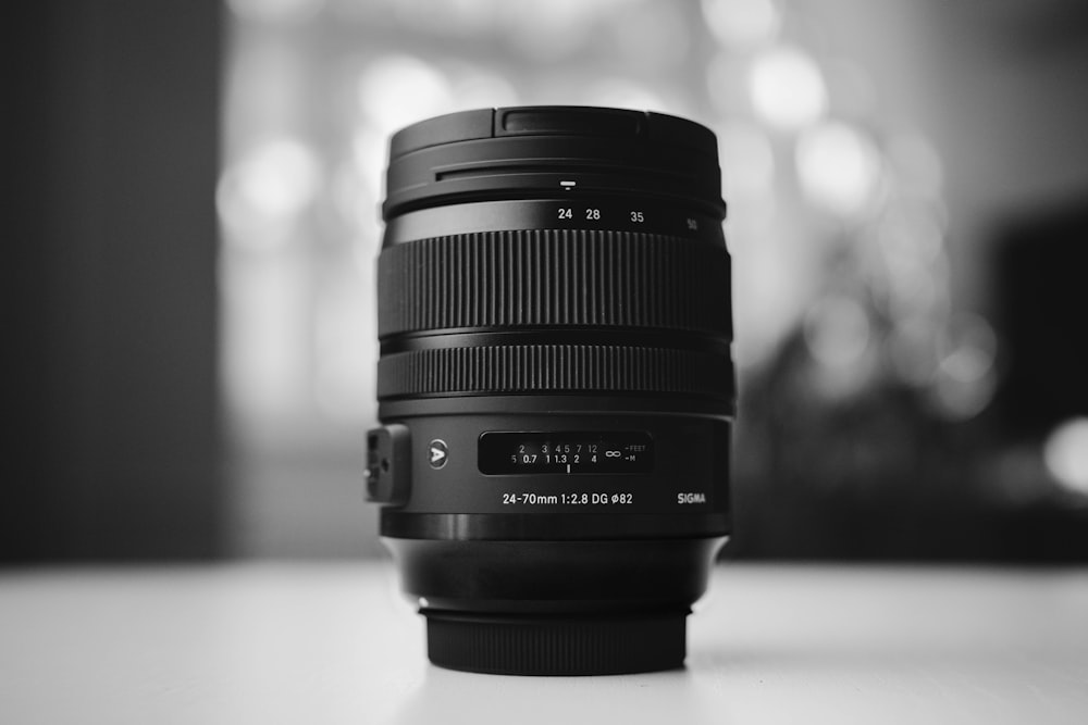 grayscale photo of DSLR camera lens