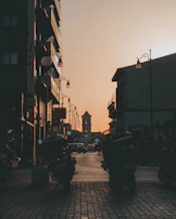 Historic cobblestone streets winding through an ancient town at dusk.