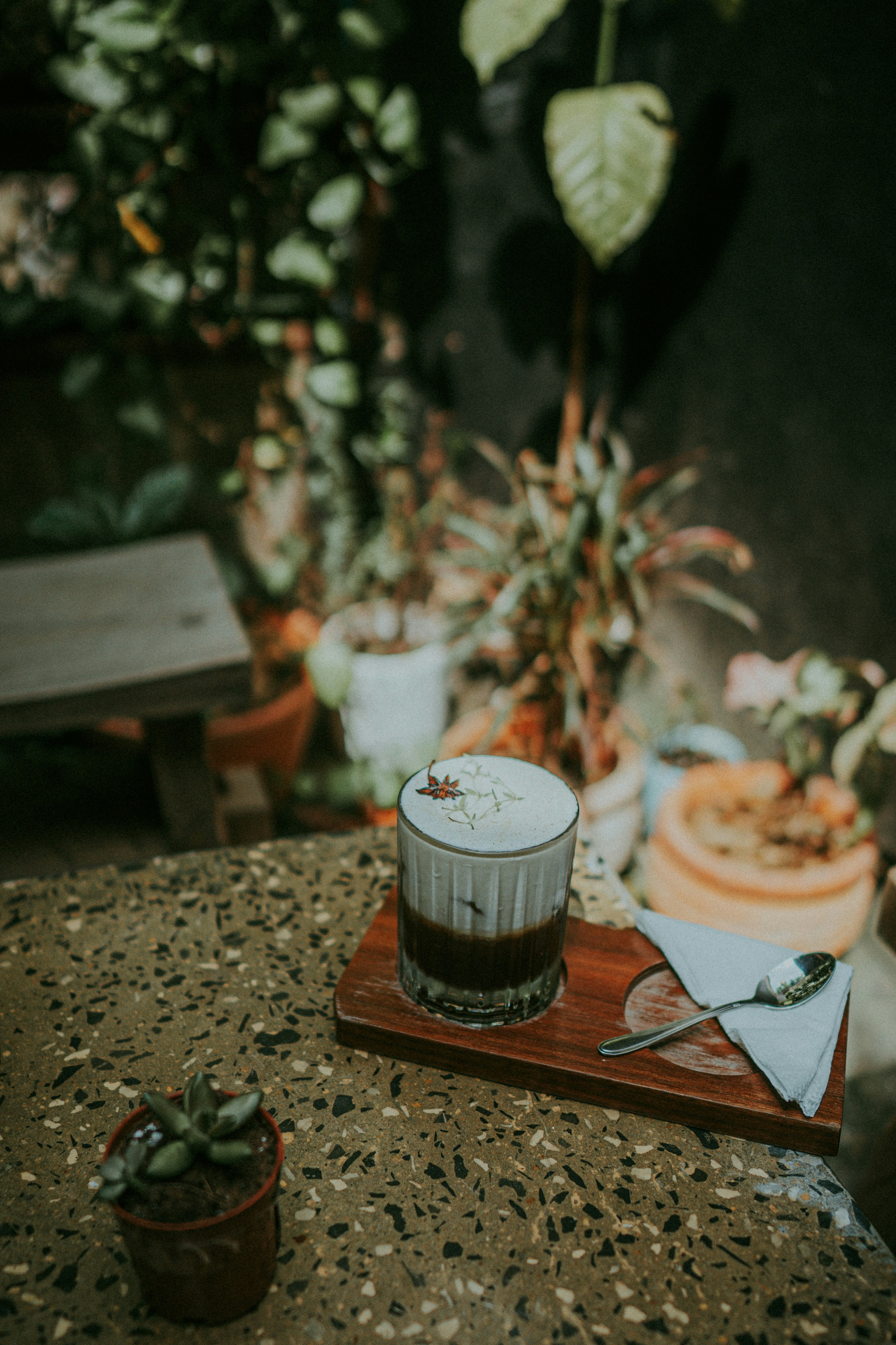 clear drinking glass filled with white and brown liquid