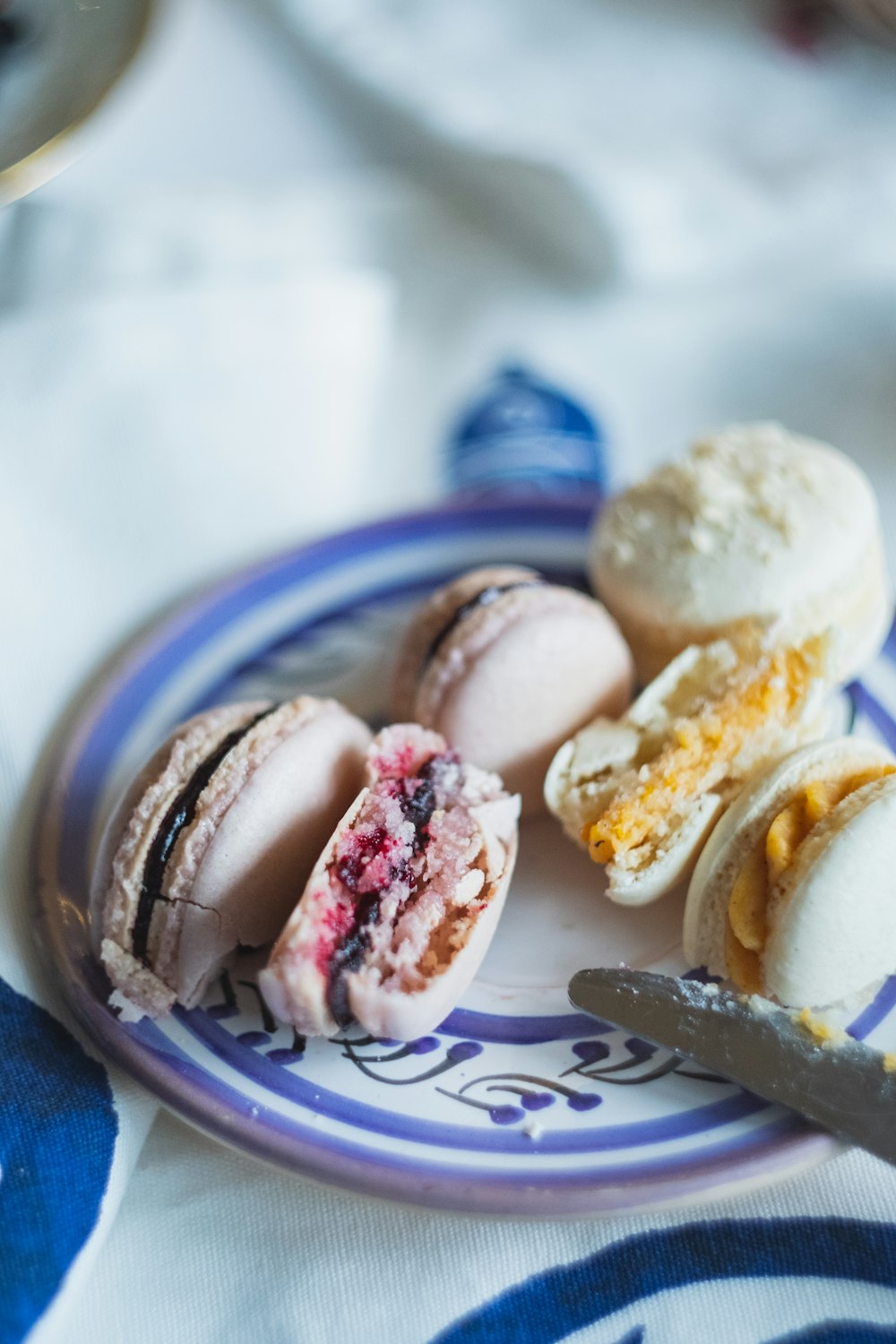 white cookies on white and blue ceramic saucer