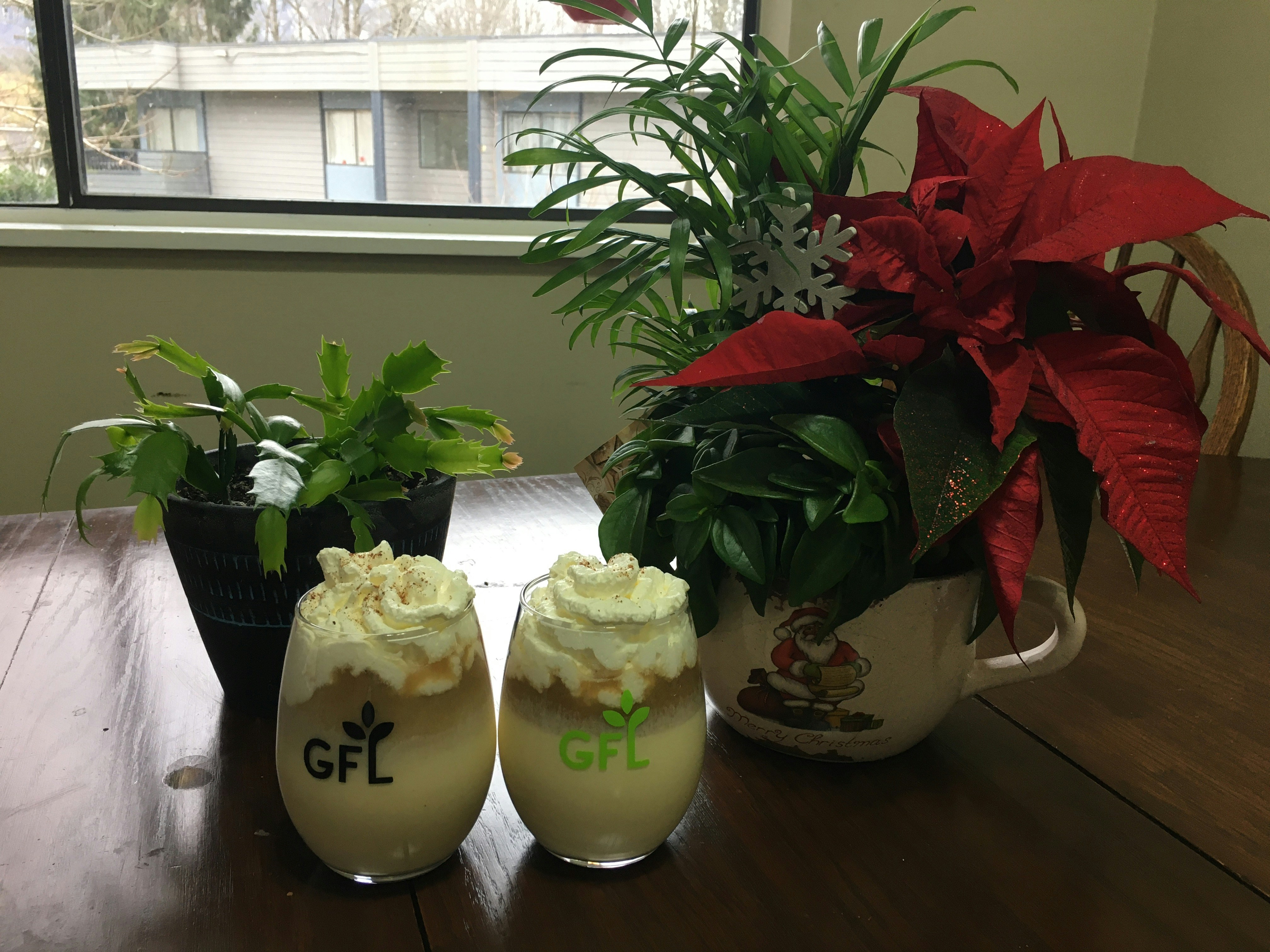 Assorted ice cream tubs arranged on a festive table with decorative elements