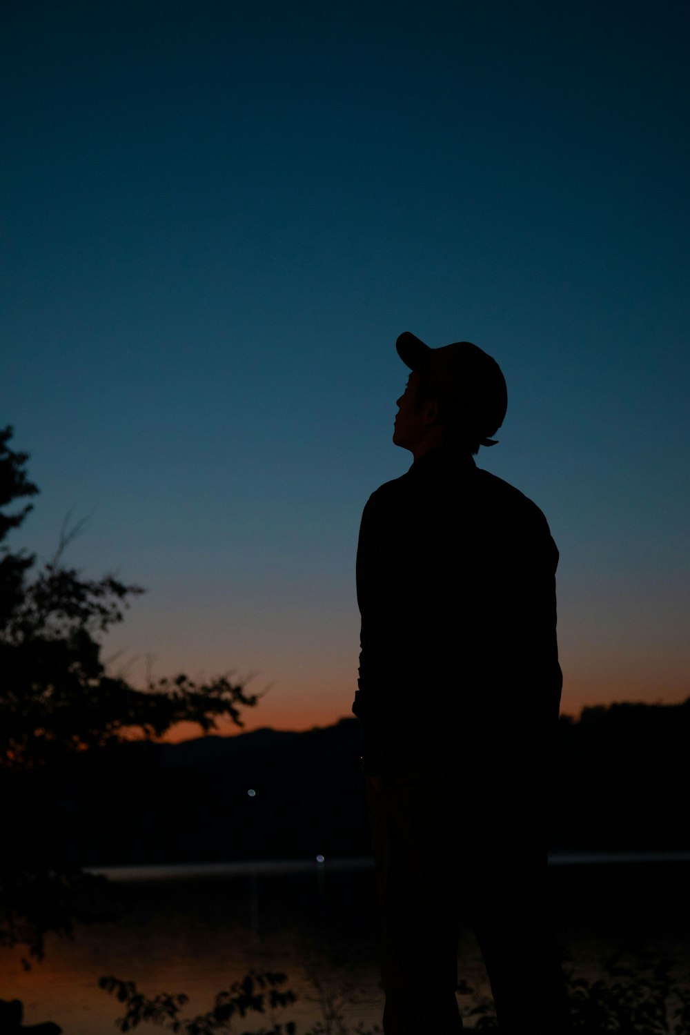 silhouette of man looking at the sky