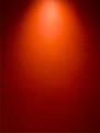 a red wall with a light on top of it