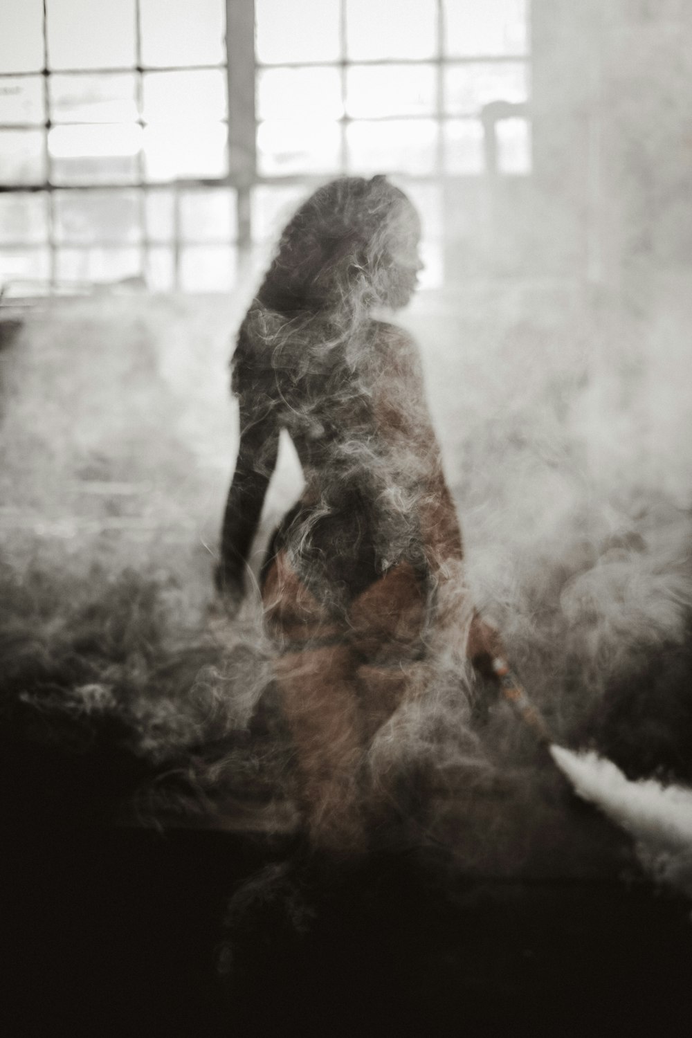woman beside white smoke