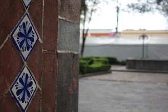 Close-up of intricate tile work used in an outdoor patio setting.