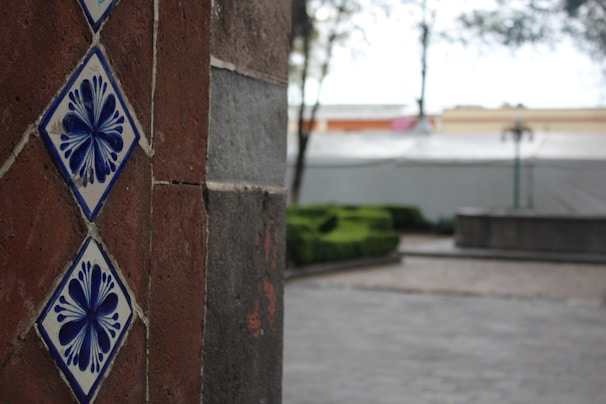 Close-up of intricate tile work used in an outdoor patio setting.