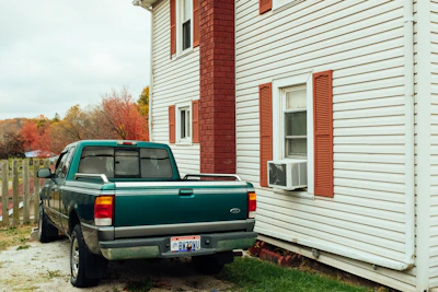 Climaviva van parked outside a house during an AC installation.