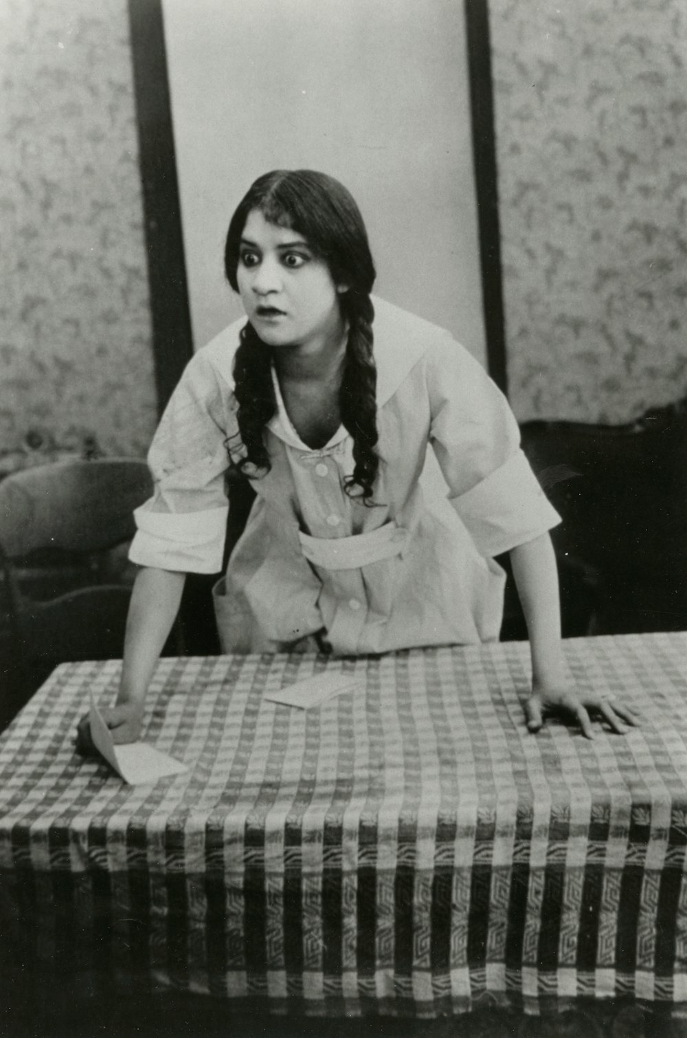 woman leaning forward on table