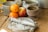 A warm kitchen scene with traditional Guatemalan cookware and colorful ingredients on a wooden table.