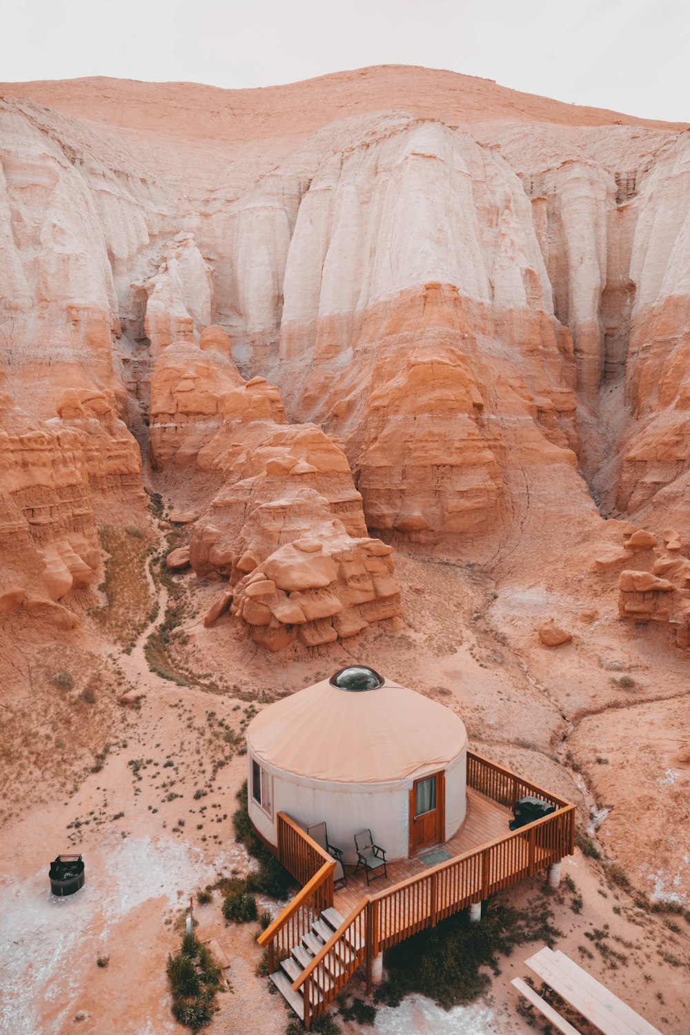 dome-shape white structure near brown mountain