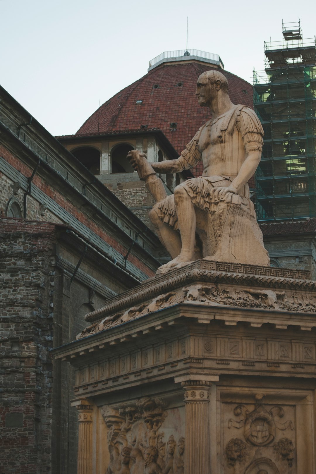 man statue near building