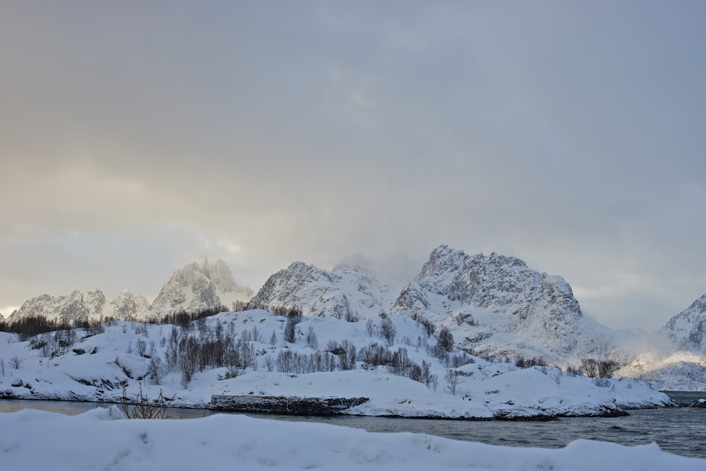 snow on rocks during daytime