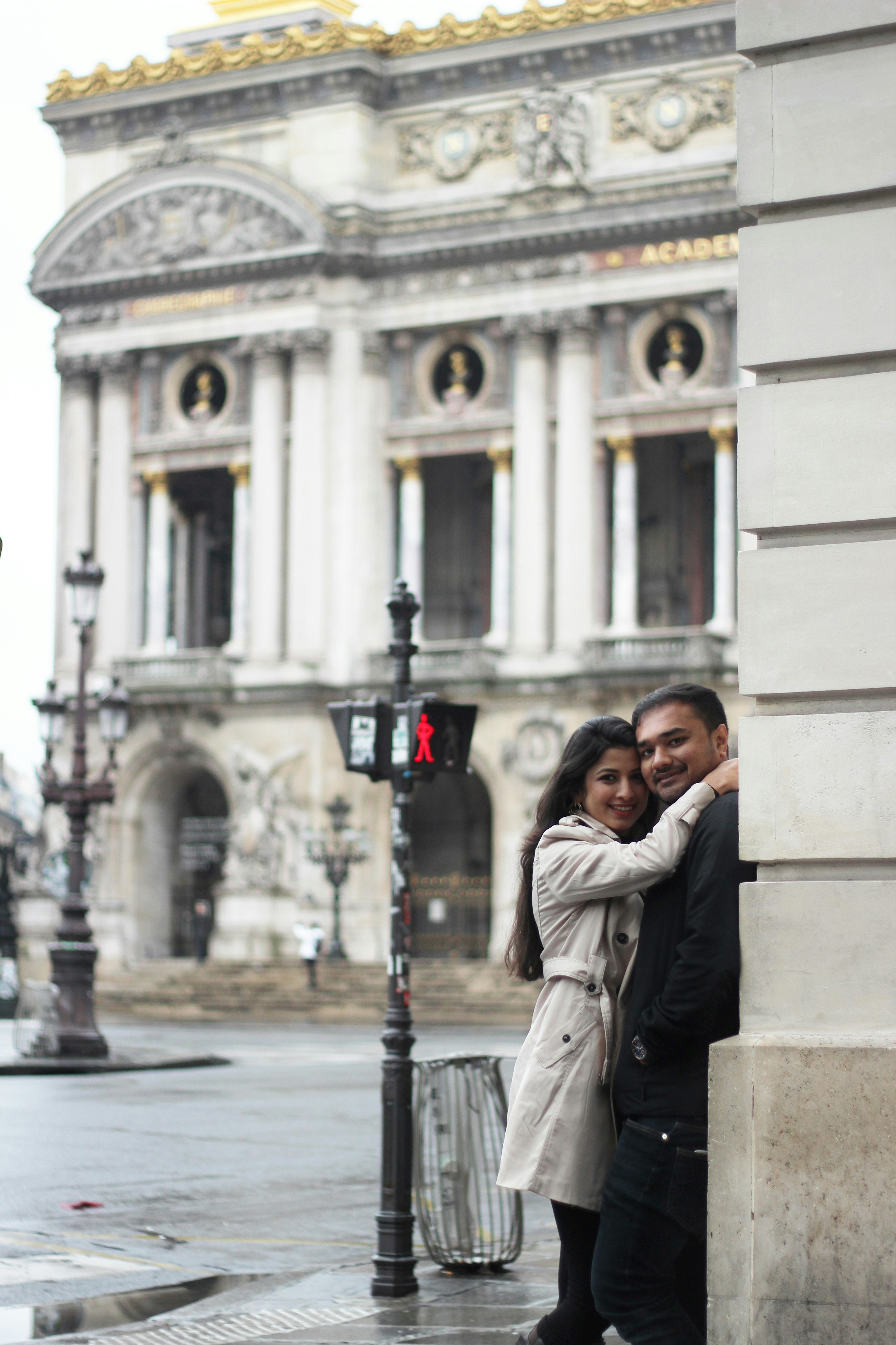 woman embracing man against wall