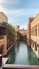 canal between concrete buildings