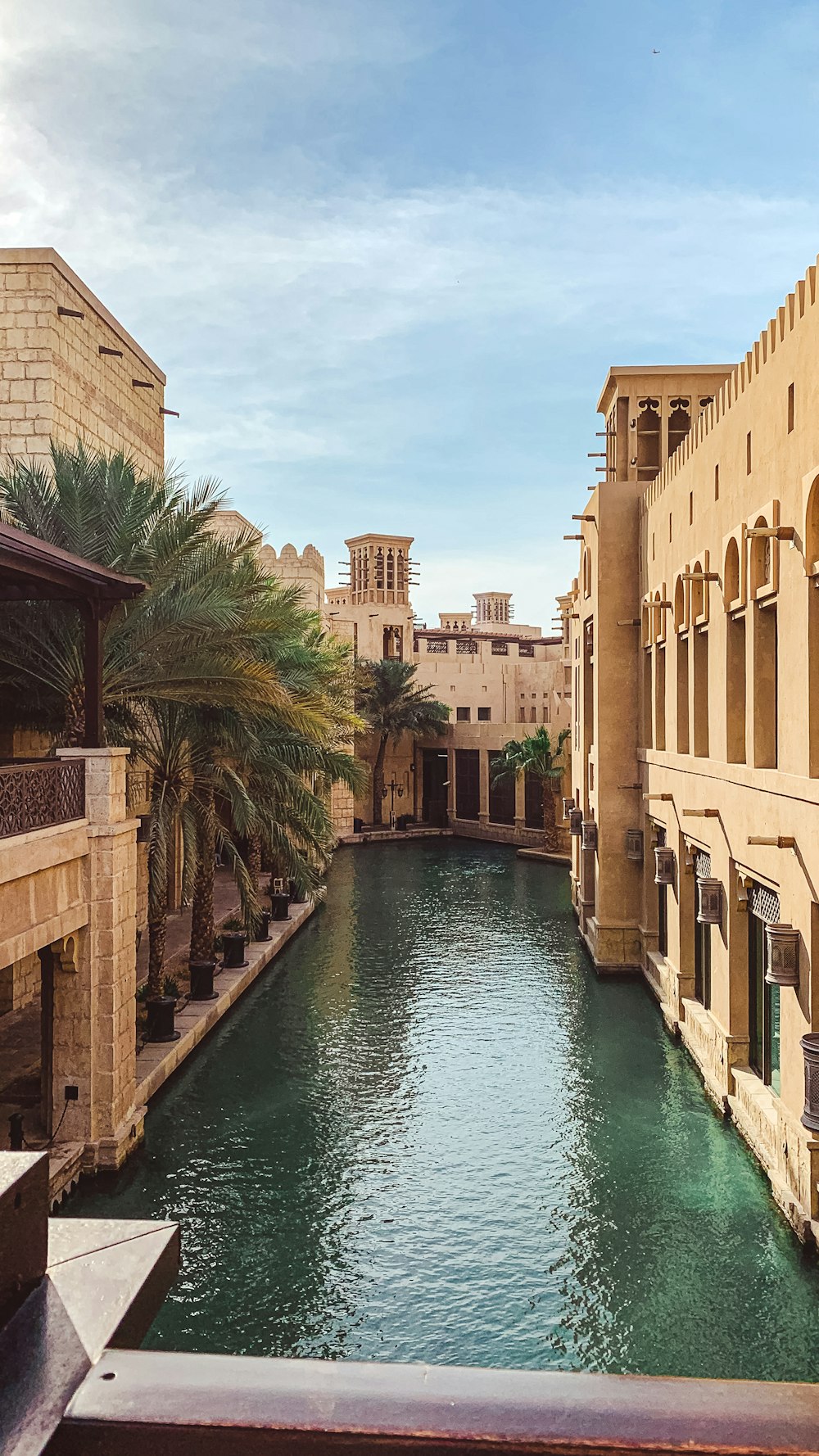 canal between concrete buildings