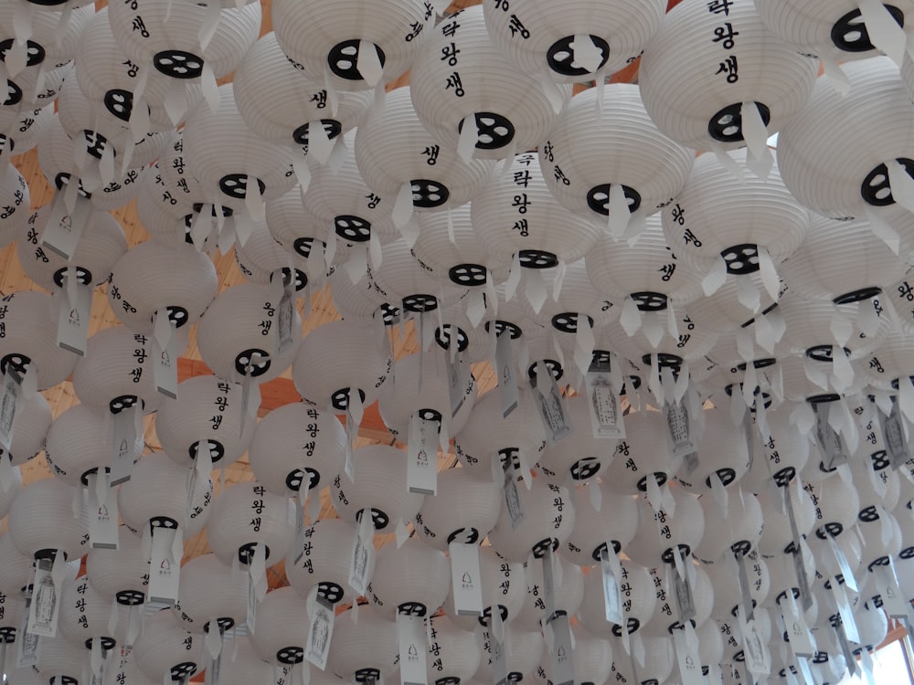 white lanterns floating on ceiling