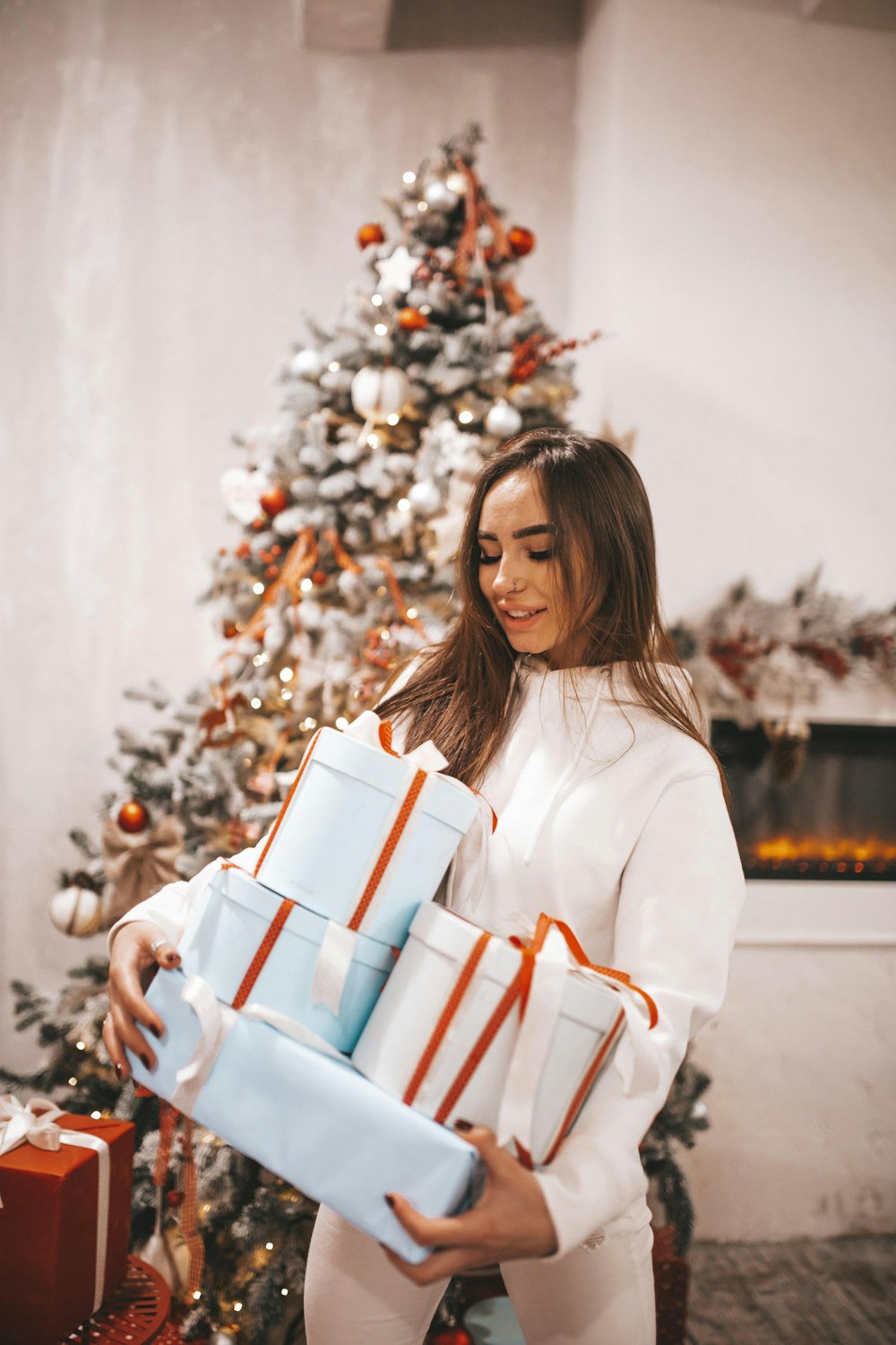 woman carrying gift boxes