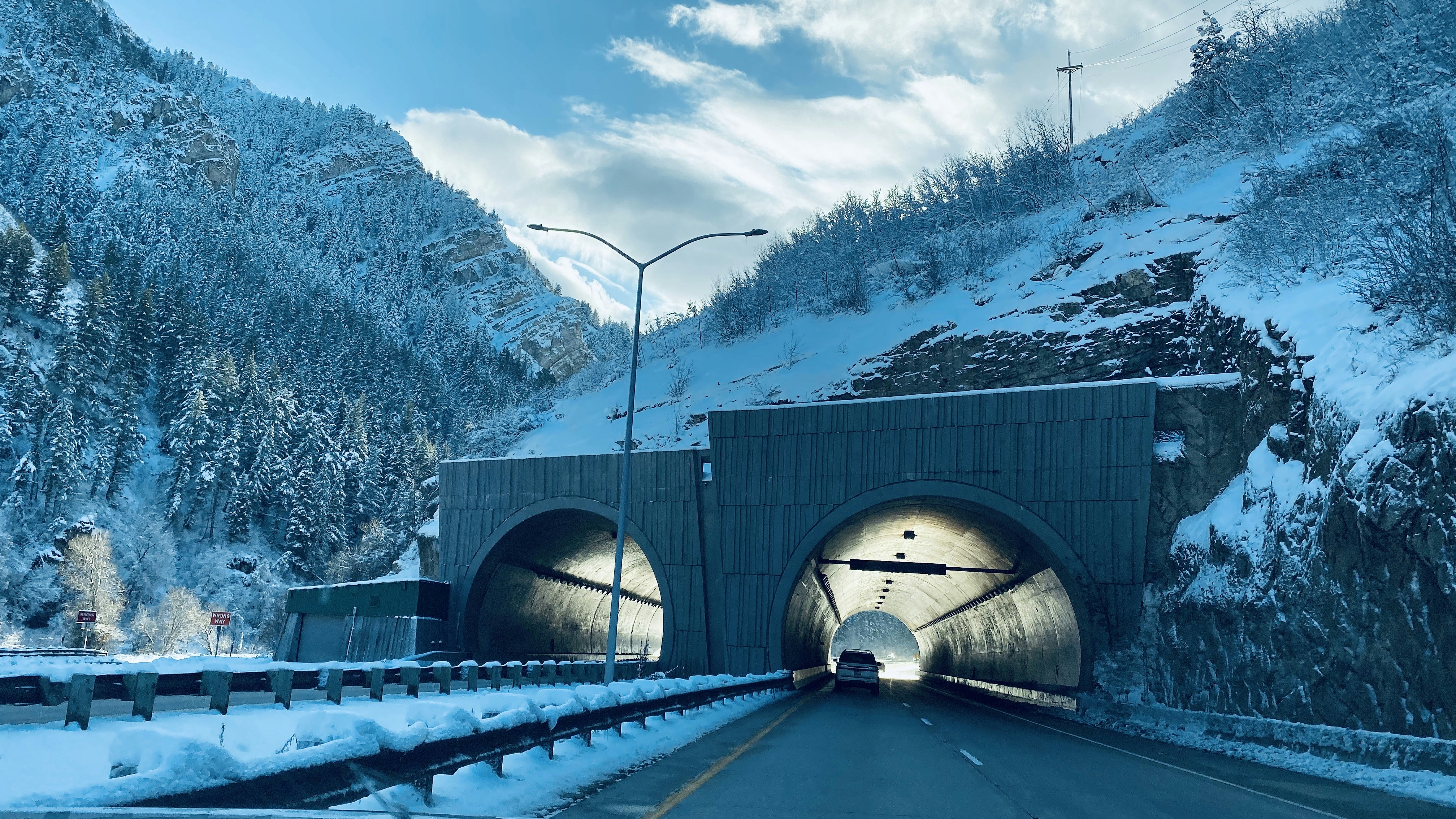 two gray concrete tunnels