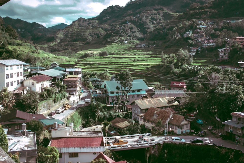 aerial photo of houses near hill