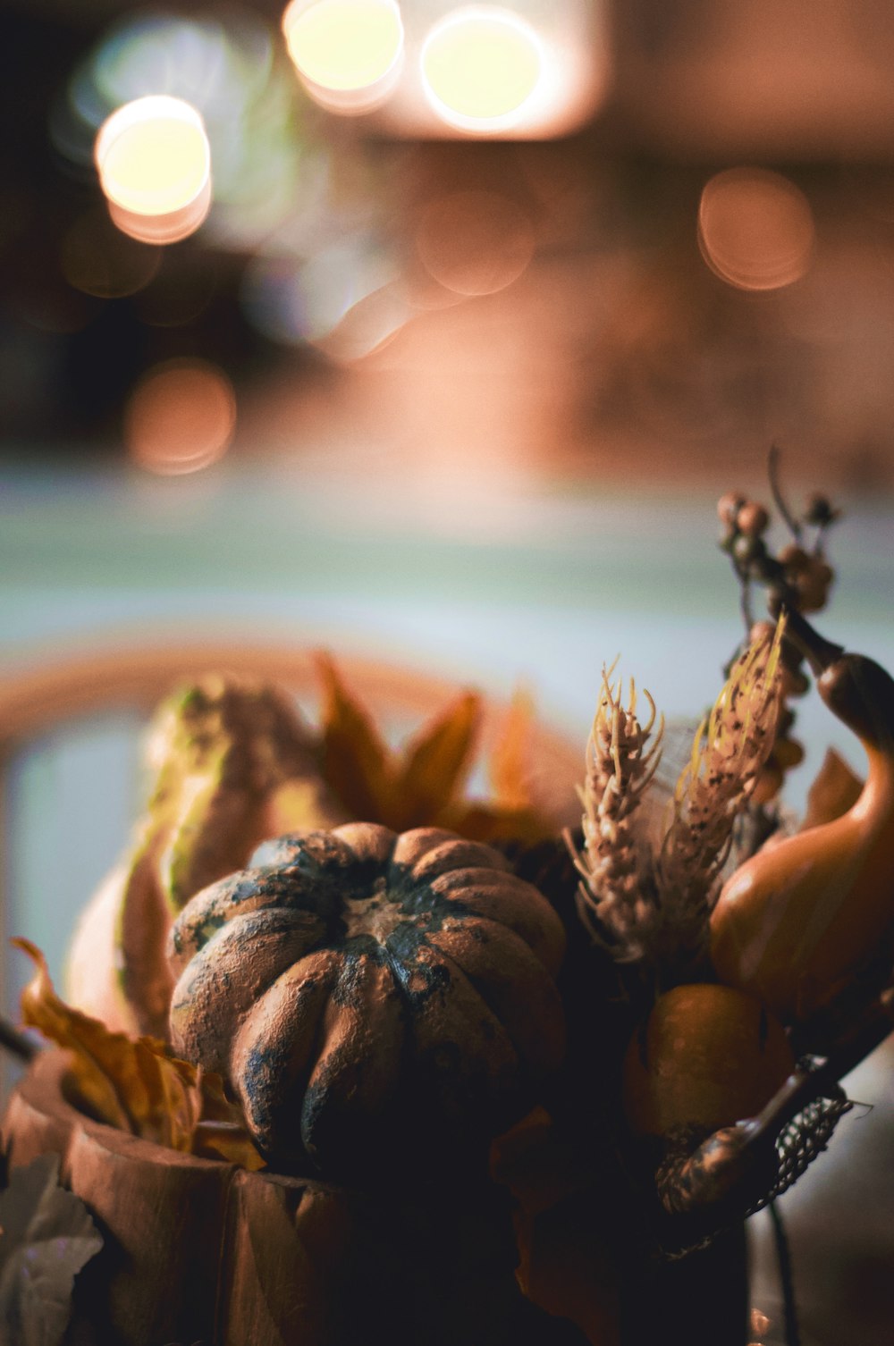 a close up of a small pumpkin on a table