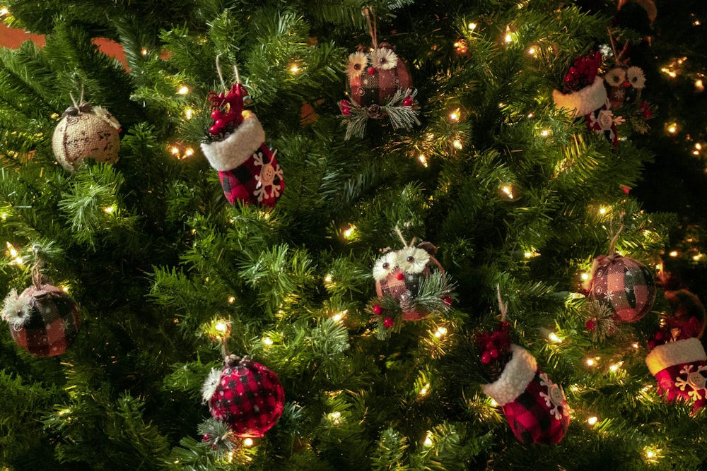 a close up of a christmas tree with ornaments on it