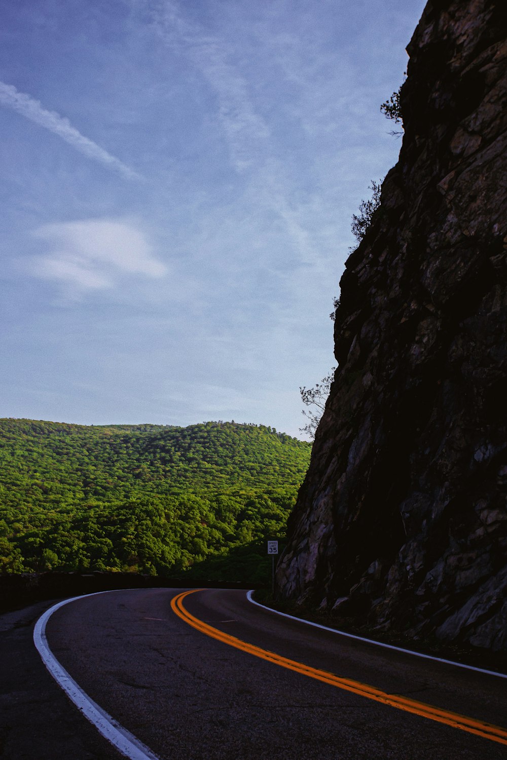 view photography of road near cliff during daytime
