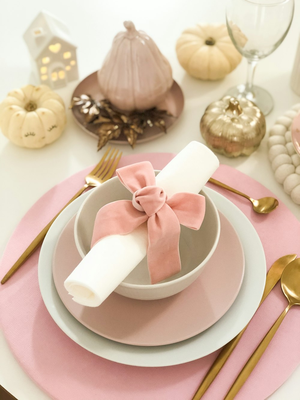 white and pink bowl and plate