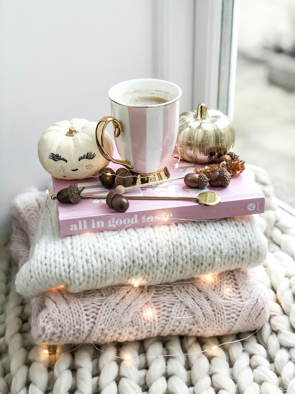 white and pink ceramic mug