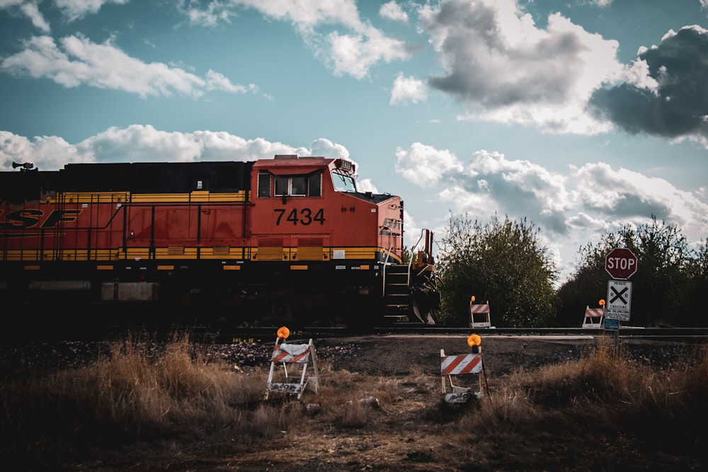 view photography of red and yellow train