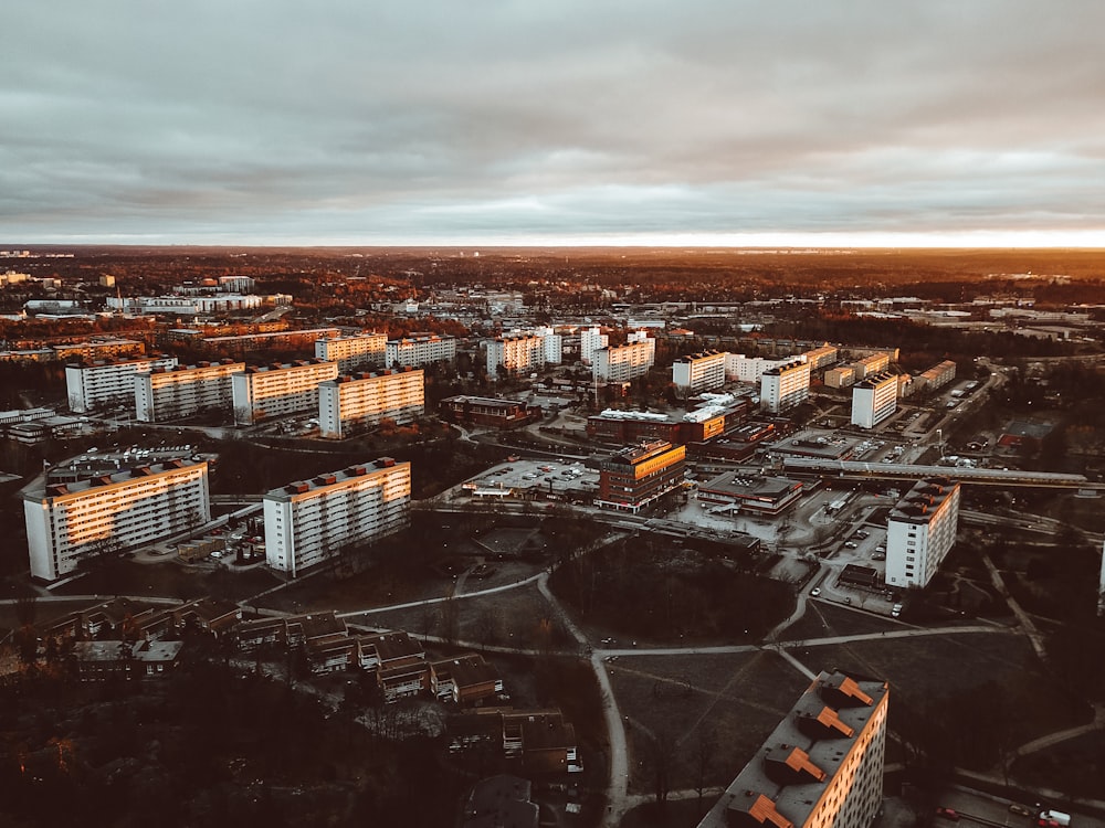 aerial photography of city with high-rise buildings under white and gray sky