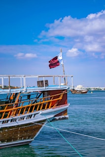boat with red and white flag