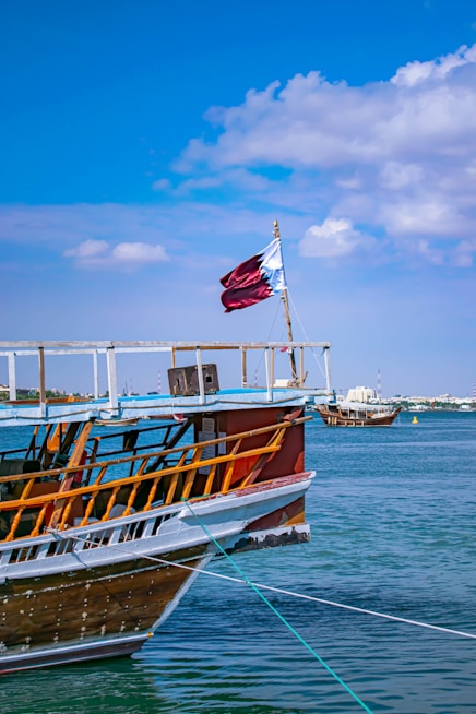 boat with red and white flag
