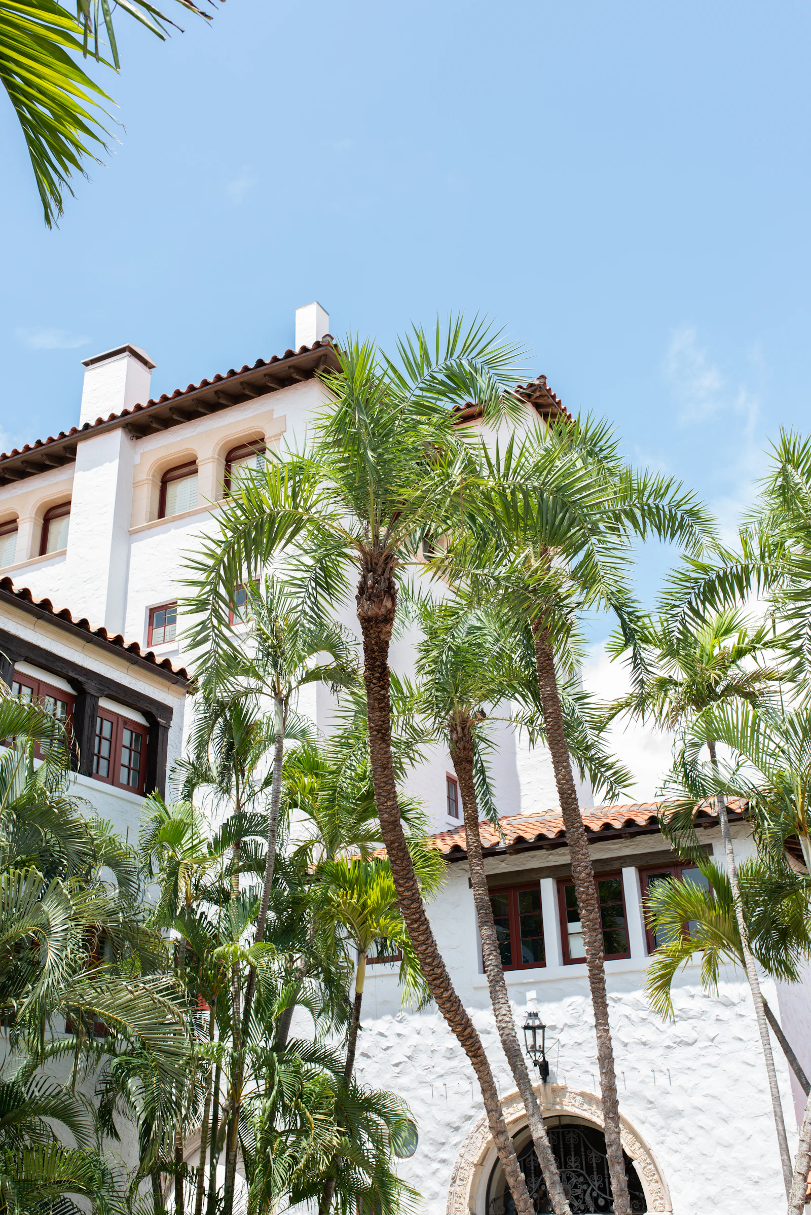 Mediterranean Revival architecture and palm trees in Palm Beach, Florida