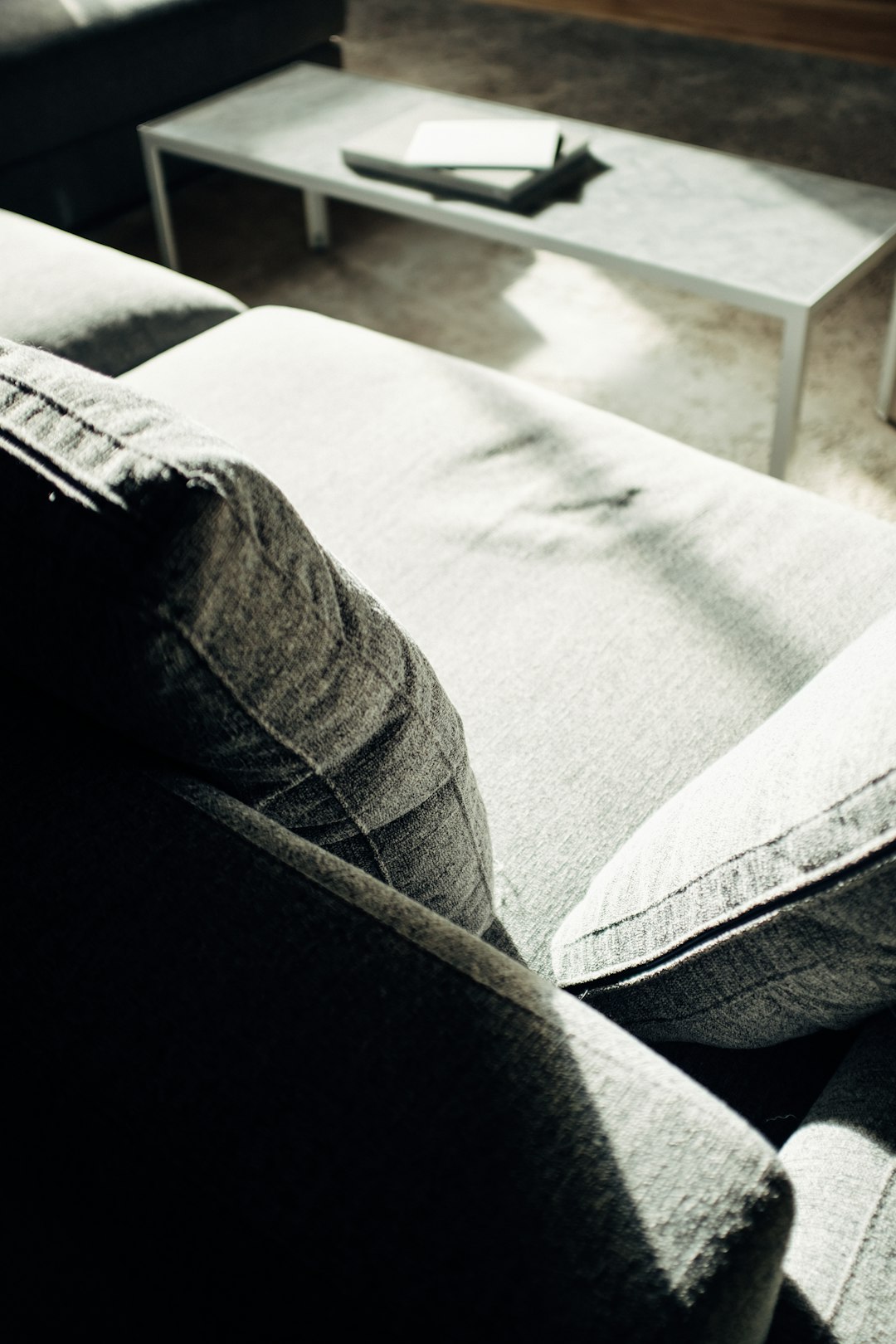 grey fabric sofa photograph
