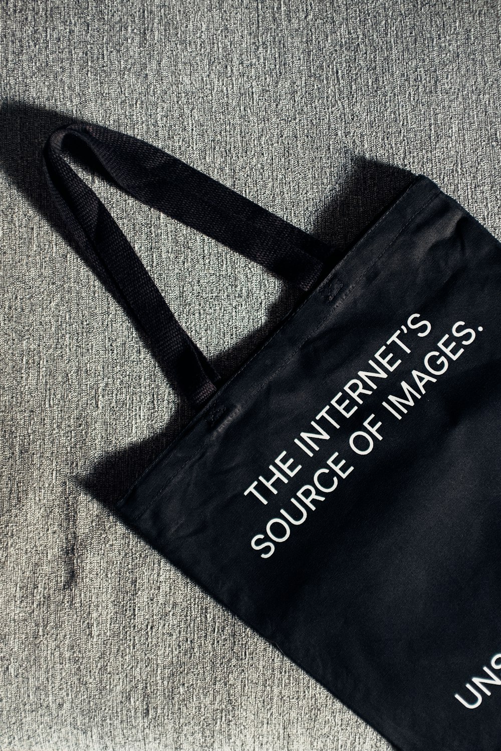 a black bag with the words the internet is source of images printed on it